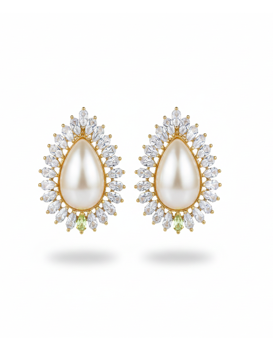 Pair of pearl earrings with gold and diamond accents on a white background