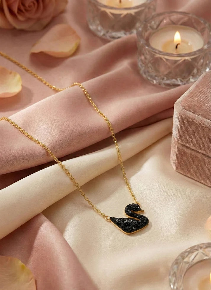 Close up swan pave black crystal gold frame pendant necklace Rose Dew