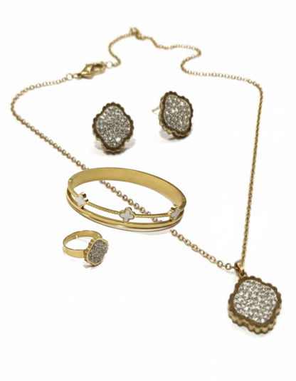 Jewelry set with necklace, bracelet, ring, and earrings on a white background