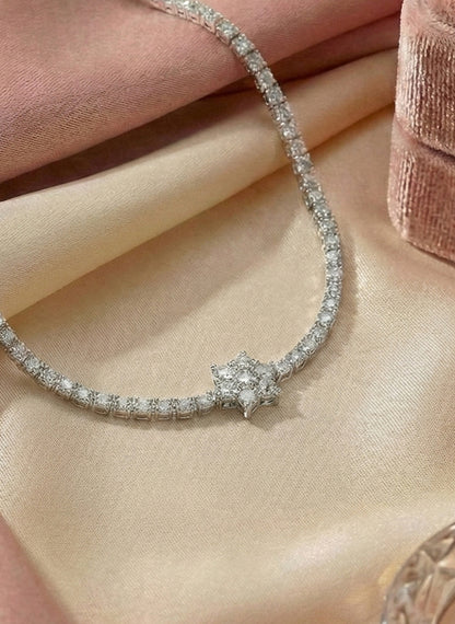 Close up floral crystal center motif pave set tennis bracelet Rose Dew silver