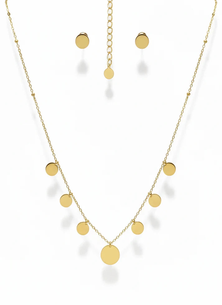 Gold necklace and earrings on a white background