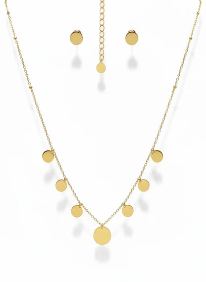 Gold necklace and earrings on a white background