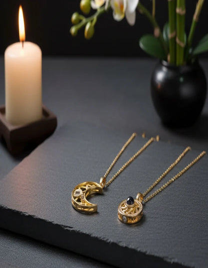 Rose Dew gold necklaces with candle and orchid for luxury gift branding.