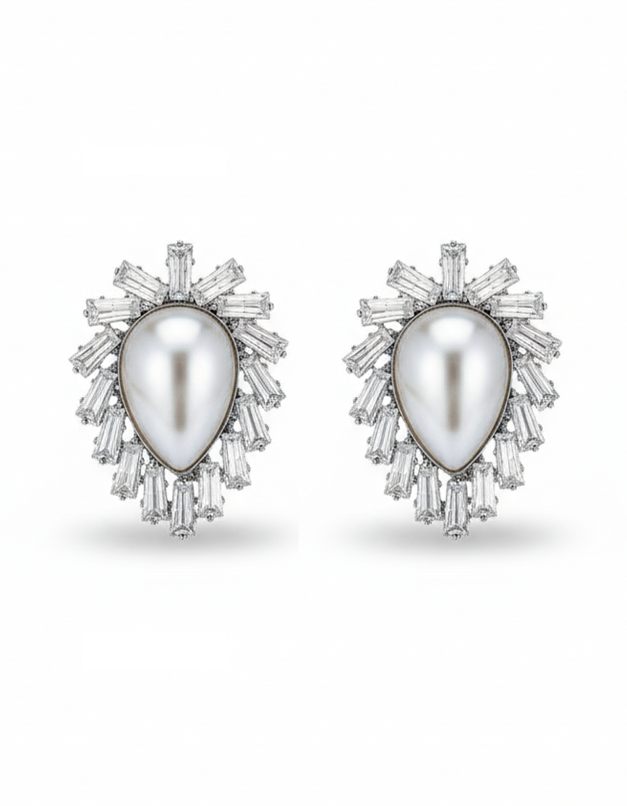 Pair of earrings with a central pearl surrounded by diamond-like stones on a white background