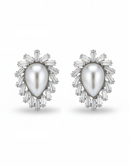 Pair of earrings with a central pearl surrounded by diamond-like stones on a white background