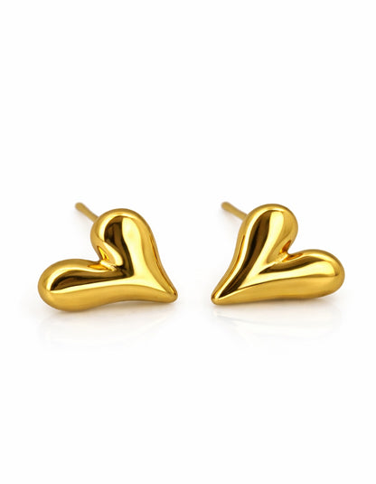 Gold heart-shaped earrings on a white background