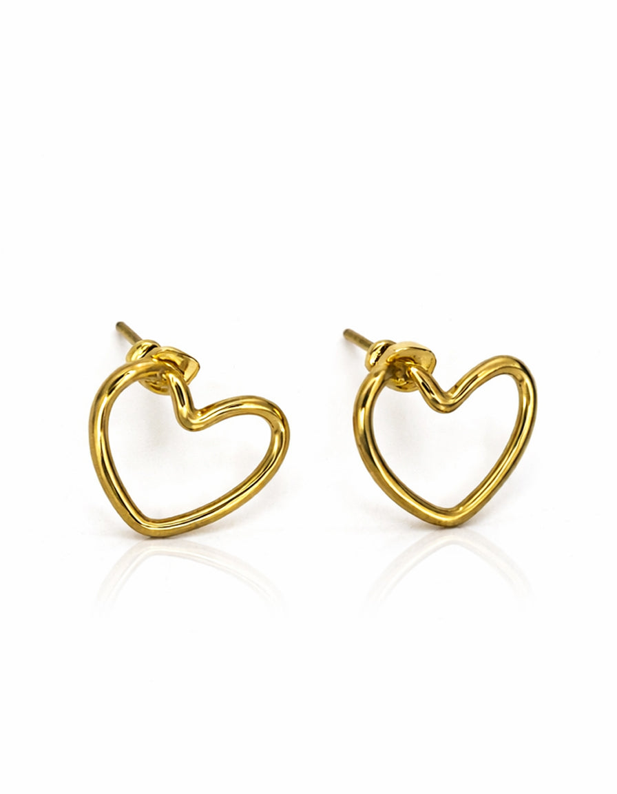 Gold heart-shaped earrings on a white background