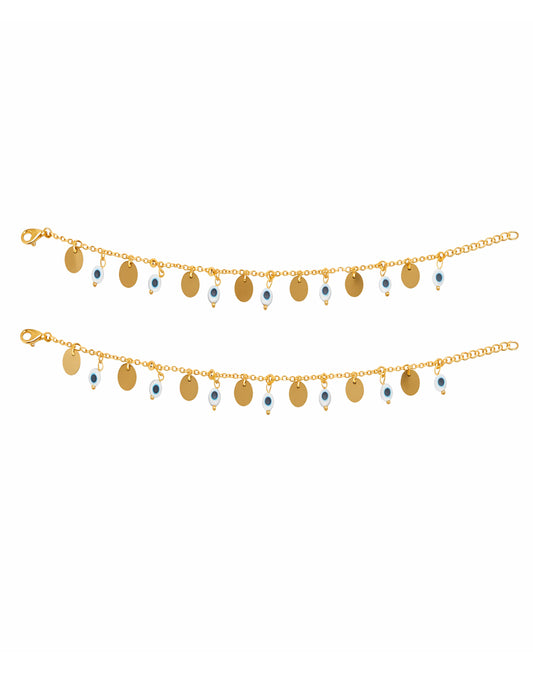 Gold anklet with small round pendants on a white background