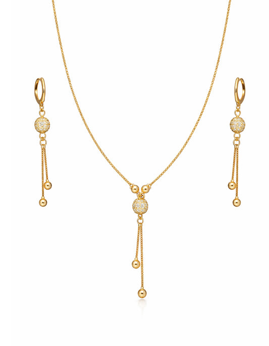 Gold necklace and earrings set on a white background