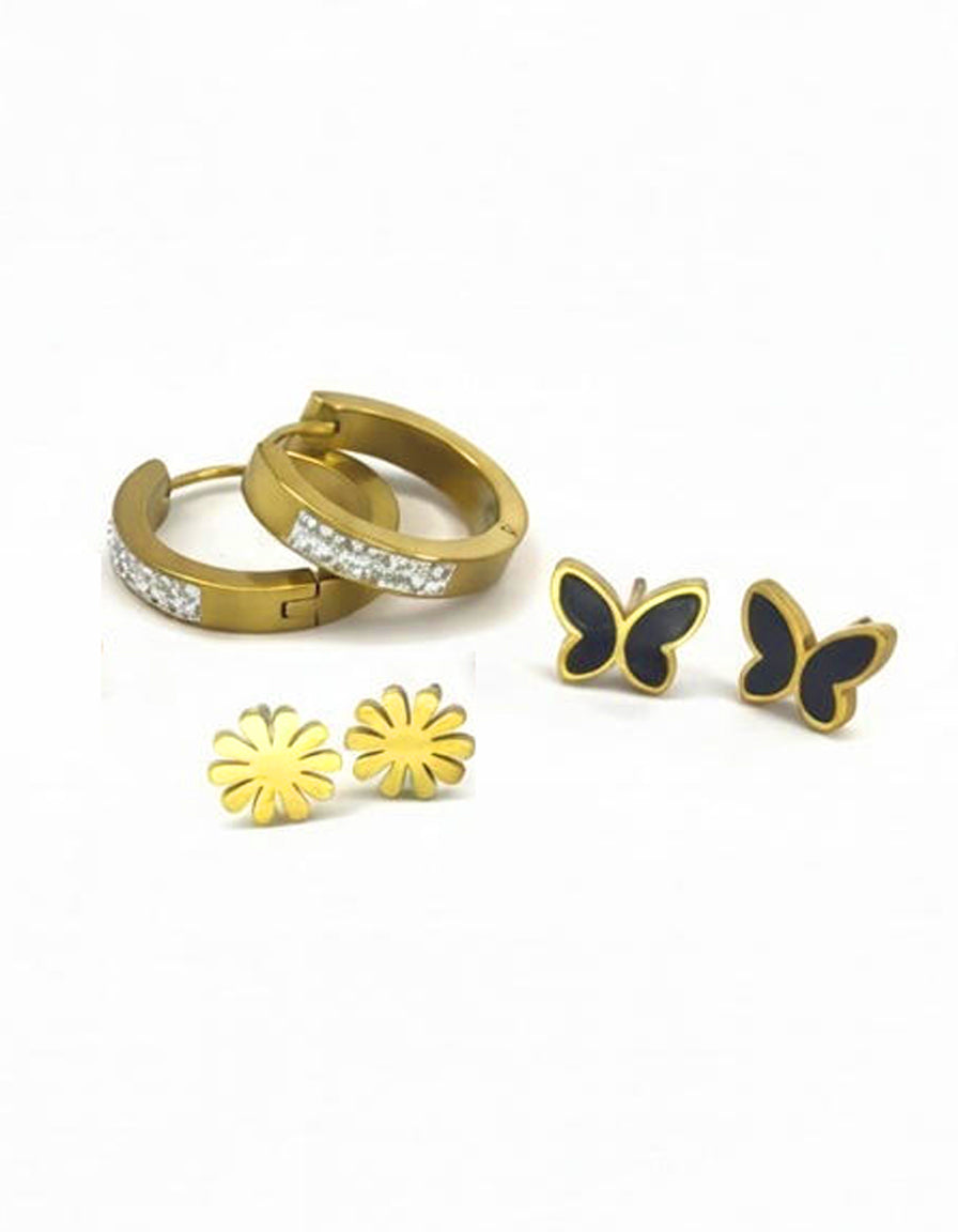 Set of gold hoop earrings, gold flower stud earrings, and black butterfly earrings on a white background