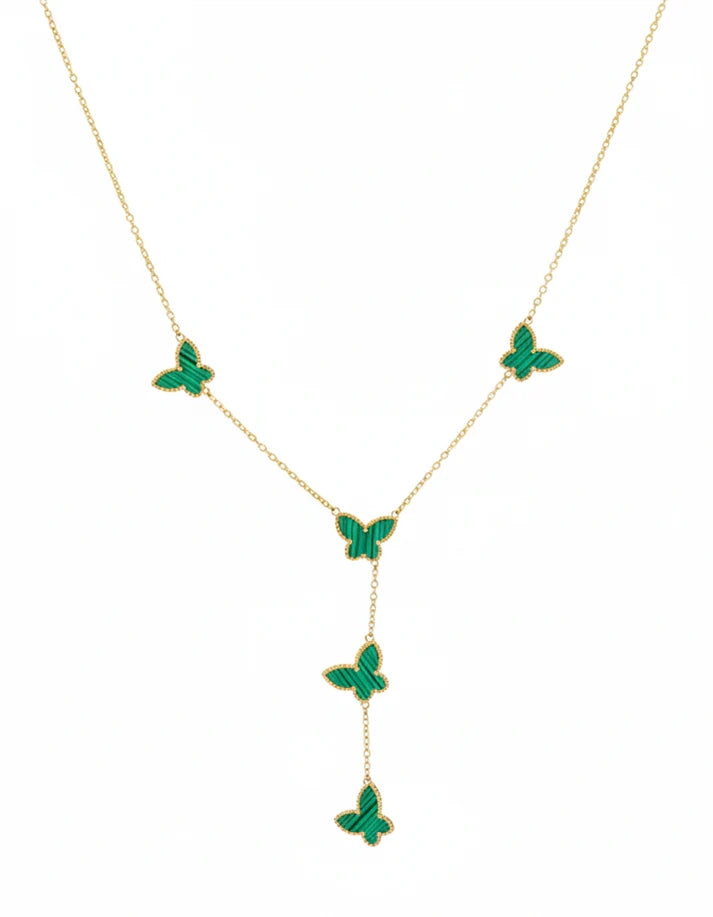 Gold necklace with green butterfly pendants on a white background