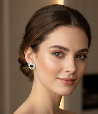 Woman wearing a daisy-shaped earring with a blurred background