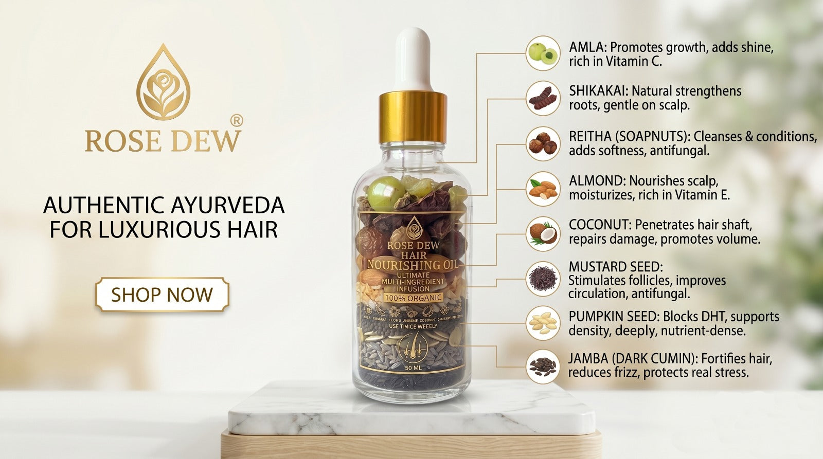 Rose Dew hair oil bottle with ingredients listed on a marble surface