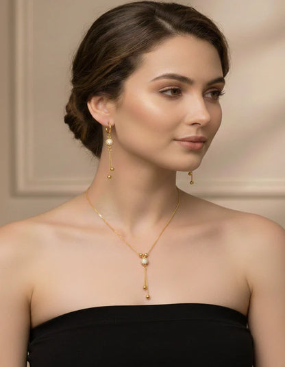 Golden sphere pavé crystal tassel earrings gold drop detail Rose Dew Pakistan