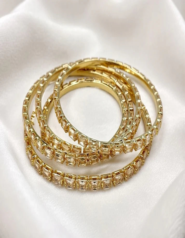 Close up champagne baguette crystal bangle gold staggered emerald cut detail Rose Dew Pakistan