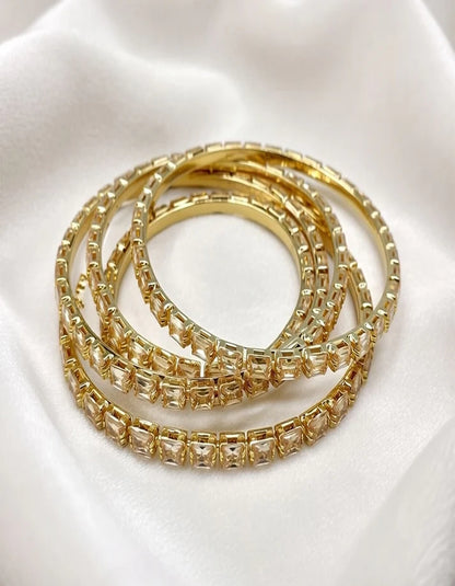Close up champagne baguette crystal bangle gold staggered emerald cut detail Rose Dew Pakistan
