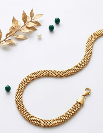 
Gilded gold tone mesh weave bold statement bracelet by Rose Dew Pakistan