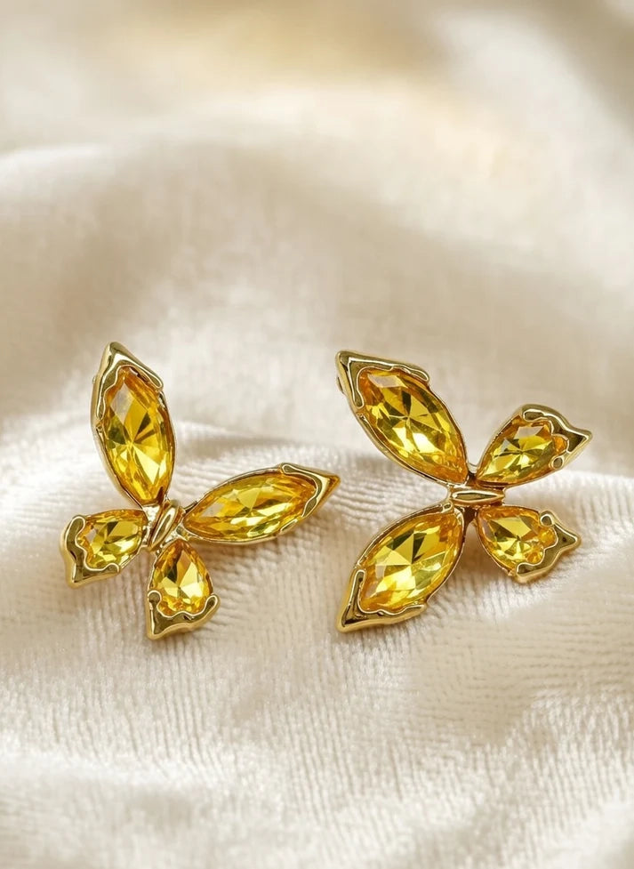 Close up golden butterfly stud earrings four wing faceted crystal motif Rose Dew Pakistan