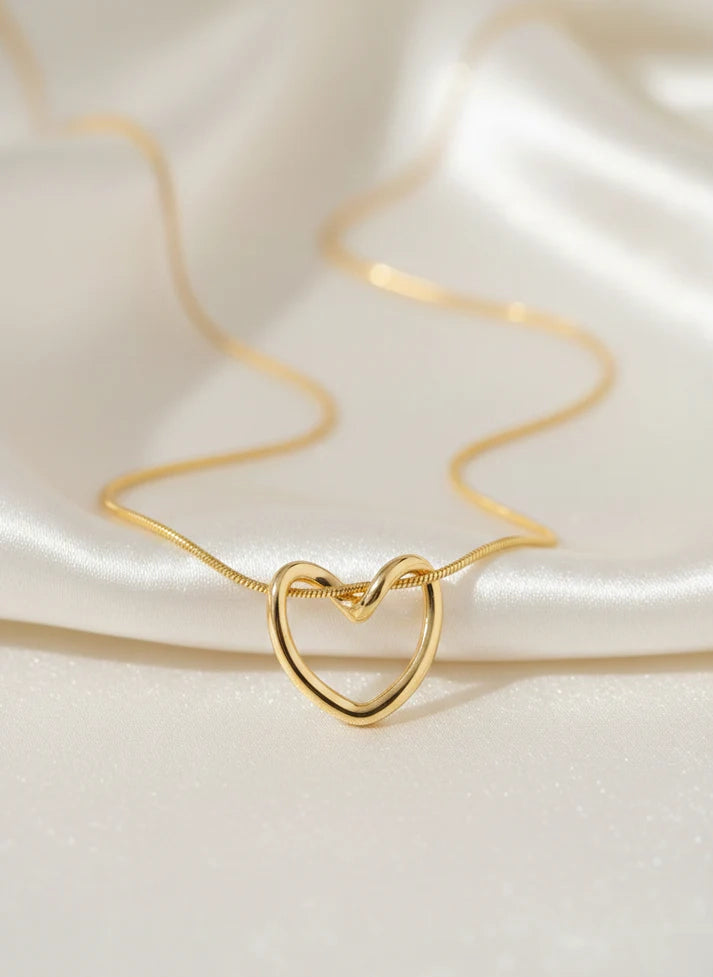 Close up large faceted crystal heart pendant gold frame necklace Rose Dew