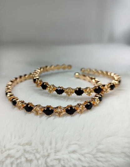 Close up midnight onyx black stone gold star motif adjustable bangle Rose Dew Pakistan