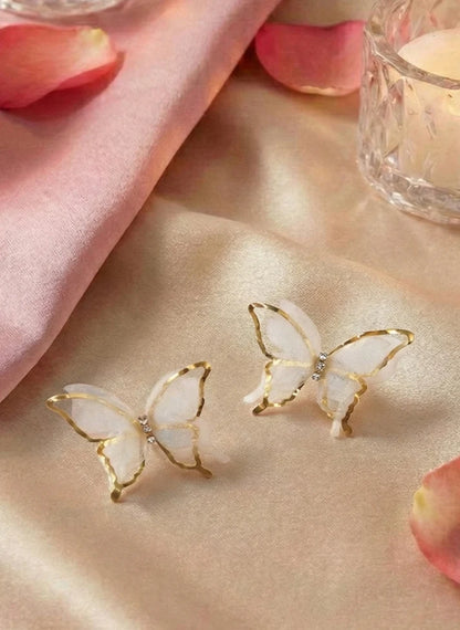 Woman wearing ethereal silk butterfly earrings garden party Rose Dew Pakistan